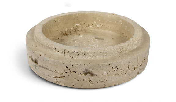 Beige travertine bowl with shallow round basin and speckled stone finish