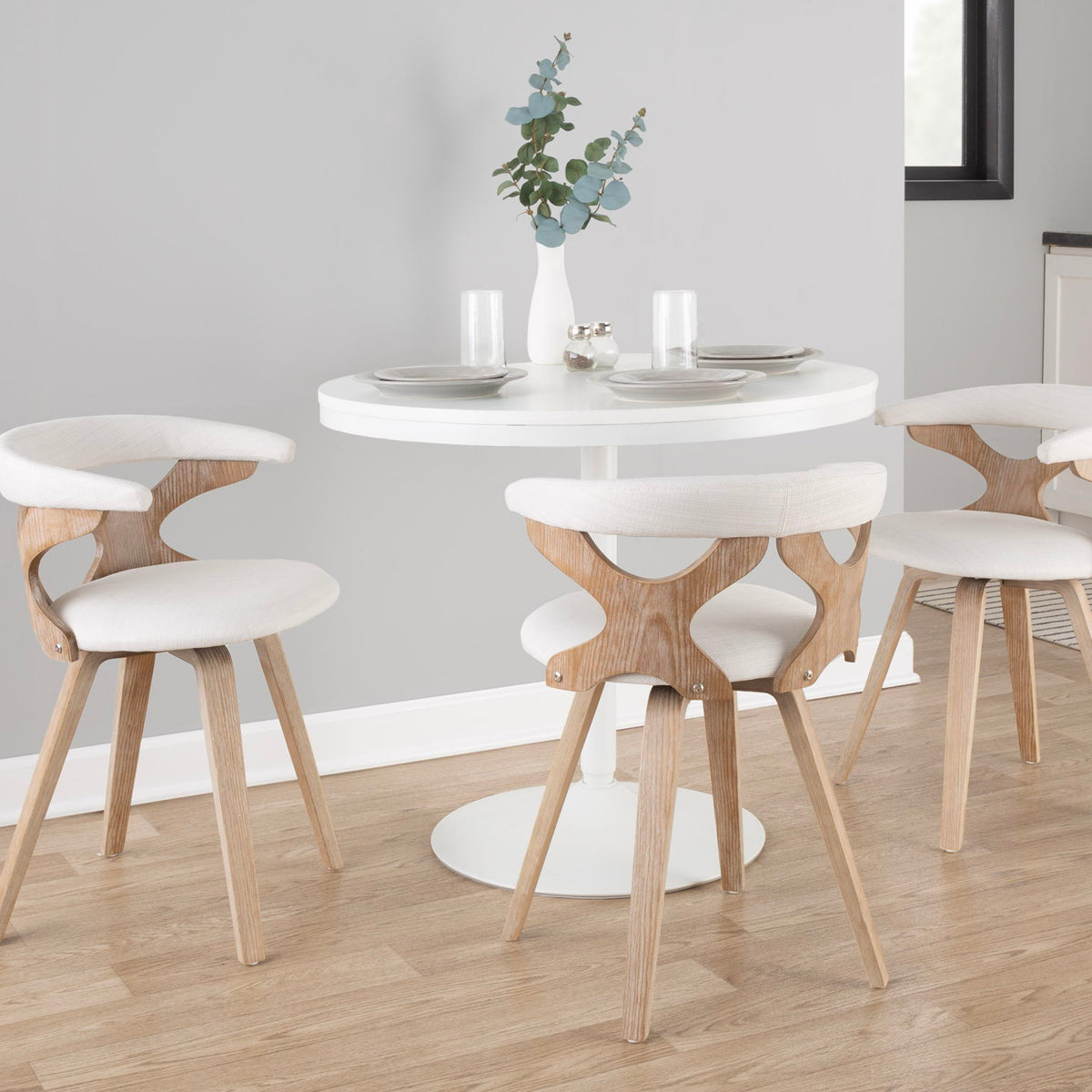 Mid-century dining chair with beige upholstery, curved back, and light wood legs