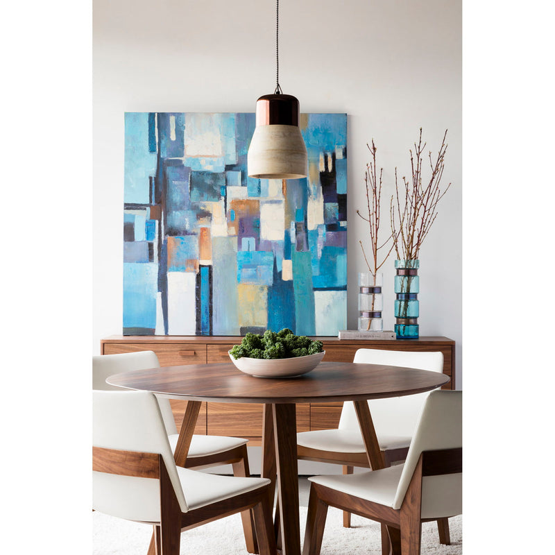 Walnut round dining table in dining room with chairs and pendant light