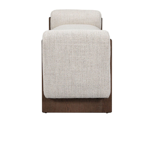 Upholstered bench end view with rounded arm, light sand fabric and dark wood legs
