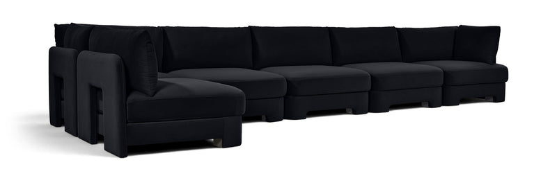 Black L-shaped armless sectional sofa with velvet-style upholstery and padded seat compartments