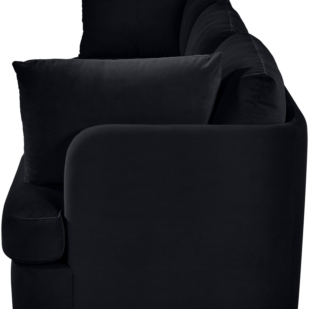 Black velvet 3-piece sofa with rounded arms and layered back cushions