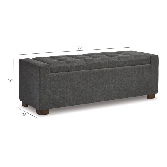 Gray upholstered storage bench with tufted top and hinged lift lid