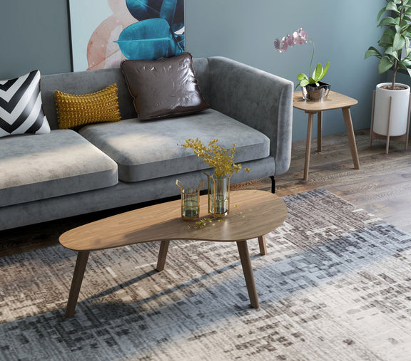 Brown oval coffee table with tapered wooden legs and rounded tabletop edges