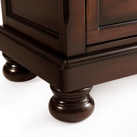 Sturdy dark brown chest with turned bun feet