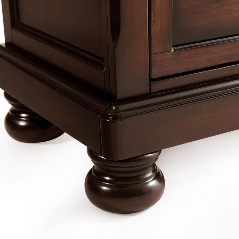 Sturdy dark brown chest with turned bun feet