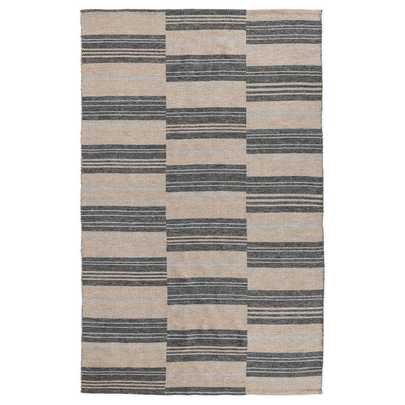 Indoor/outdoor striped patchwork rug with beige, tan, and dark gray horizontal blocks