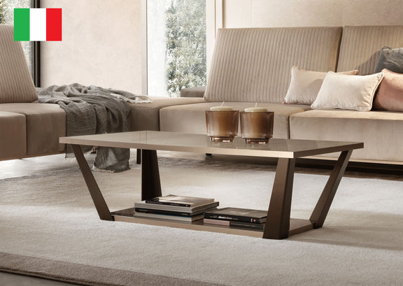 Rectangular beige coffee table with dark brown apron and open lower shelf