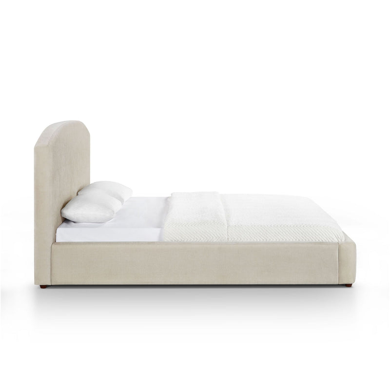 Low profile upholstered bed with tall headboard, light brown fabric, white bedding