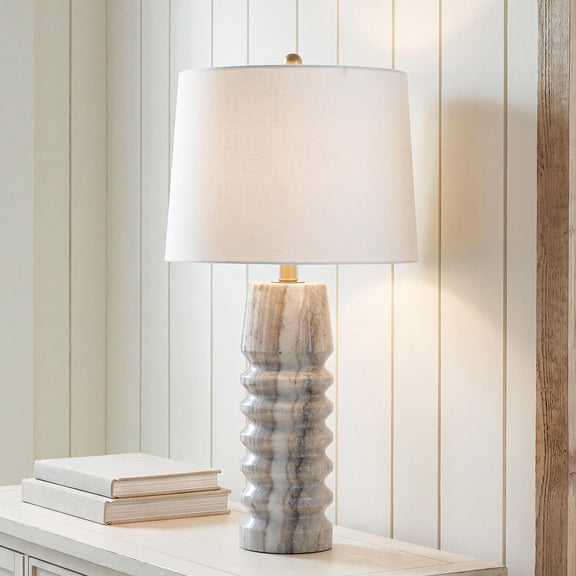 Desmont marble table lamp with cream fabric shade and gray stone base