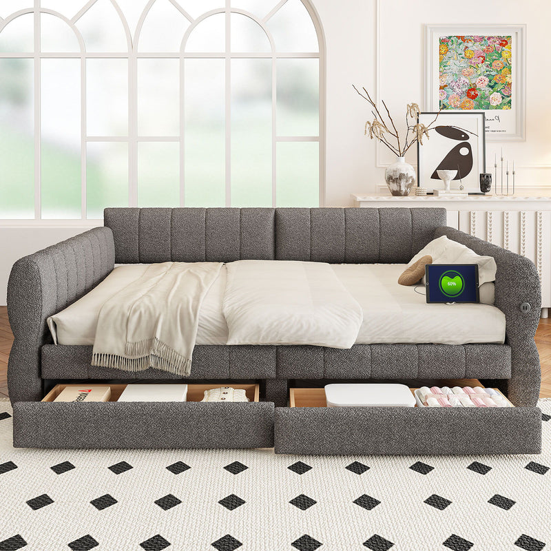 Upholstered platform bed in dark gray upholstery with two storage compartments