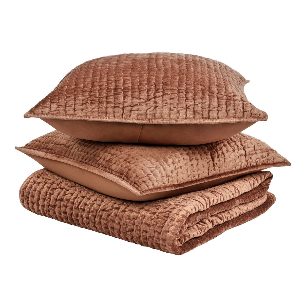 Terracotta velvet quilt set with folded quilt and matching decorative pillows