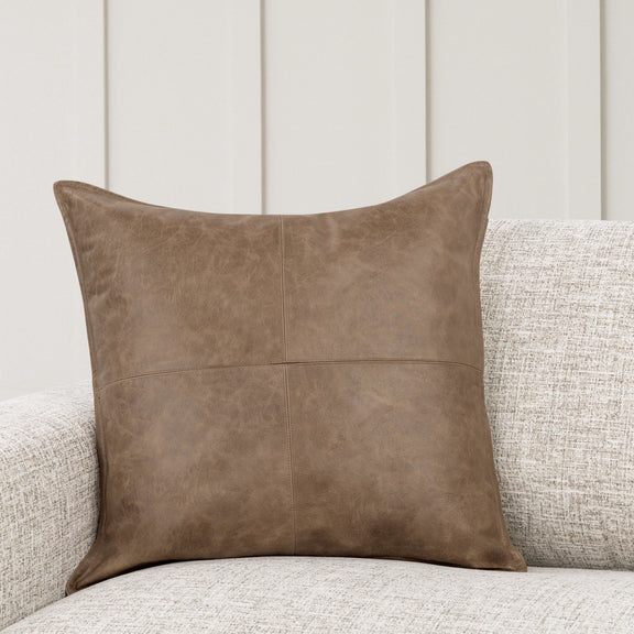 Brown leather accent pillow, square shape with stitched panel seams