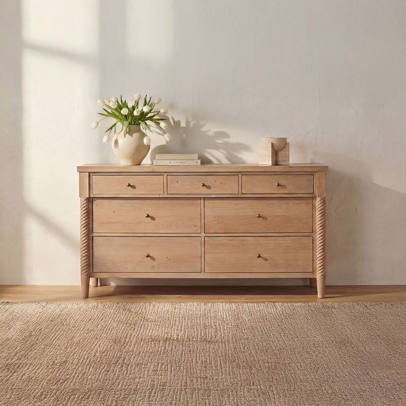 Natural wood 7-drawer dresser with metal knobs and woven side panels