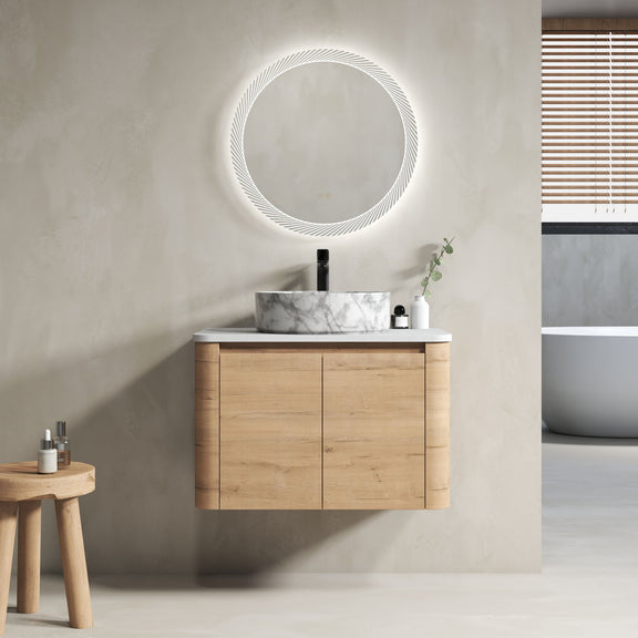 Wall-mounted bathroom vanity with light-wood cabinet and white marble art sink, round mirror