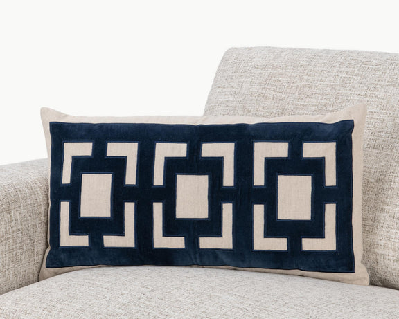Rectangular pillow with navy geometric pattern and beige border