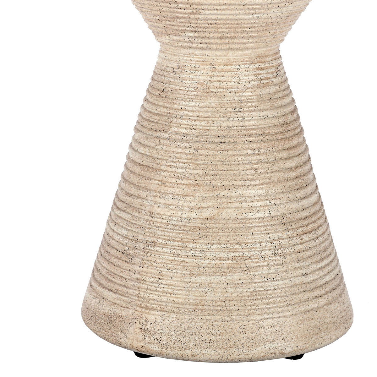 Beige outdoor accent table with hourglass base and textured speckled finish