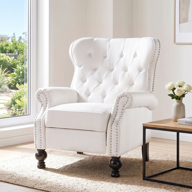 Purple tufted recliner chair with studded trim and curved armrests.