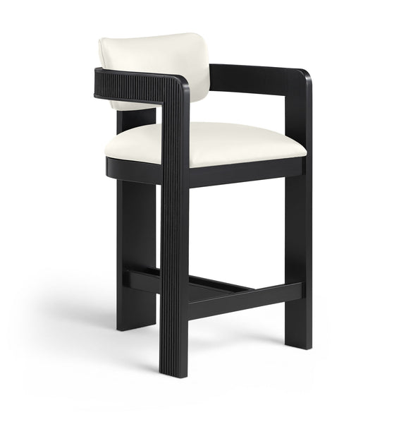White vegan leather counter stool with padded seat and fluted back panel on black frame
