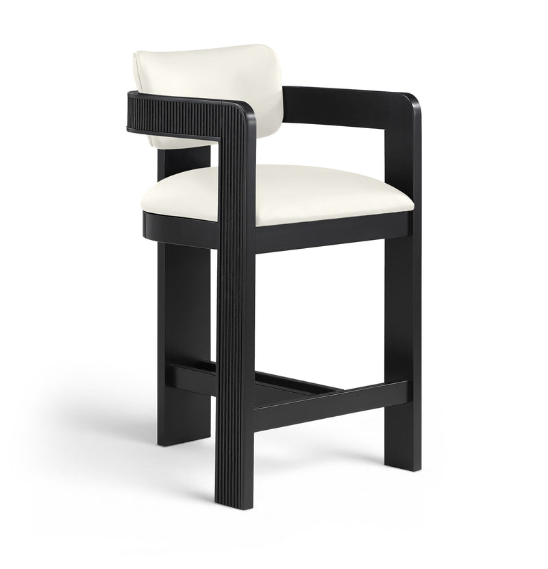 White vegan leather counter stool with padded seat and fluted back panel on black frame