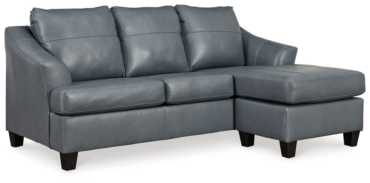 Gray sofa chaise with three seat cushions and tufted back, dark tapered legs