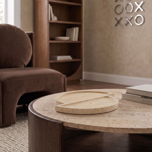 Beige travertine tray on a tabletop, two circular halves stacked.