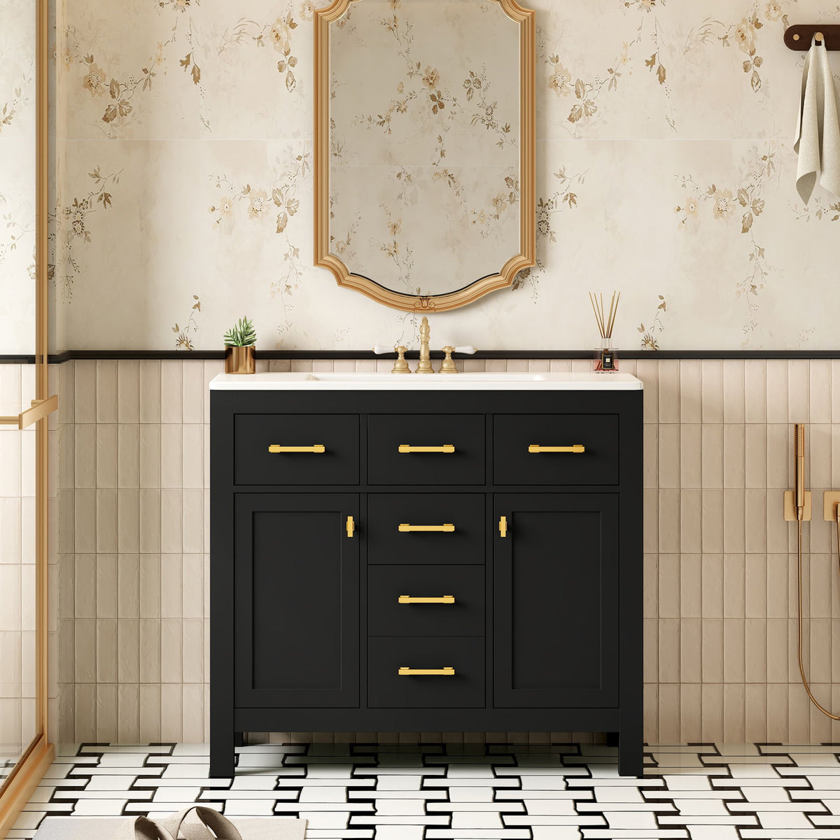 Black bathroom vanity with white sink, four drawers, two doors, and gold-tone pulls