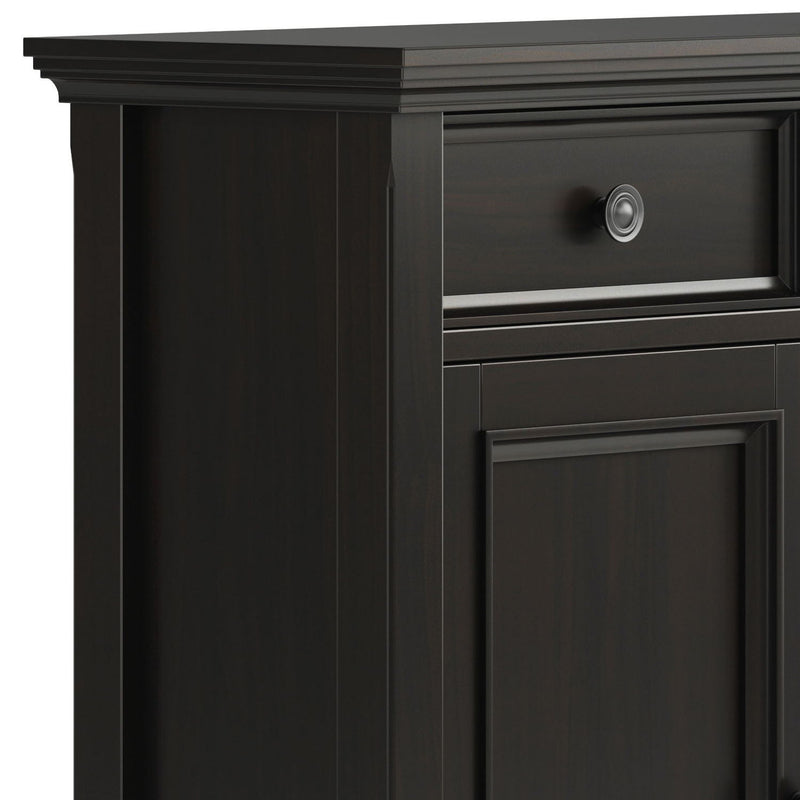 Close-up of the Amherst cabinet's drawer pull, paneled door, and layered top