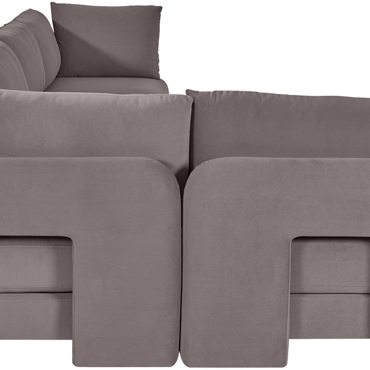 Gray velvet L-shaped sectional sofa with padded backrests and chaise seating