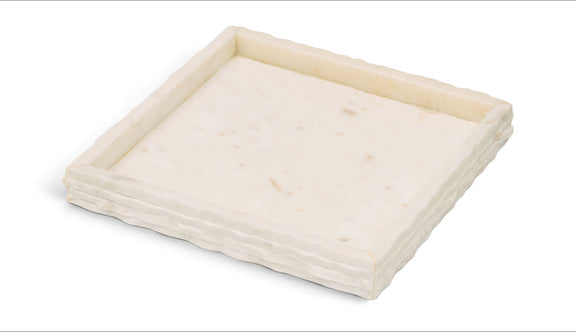White marble tray with faint speckles and a raised, squared border.