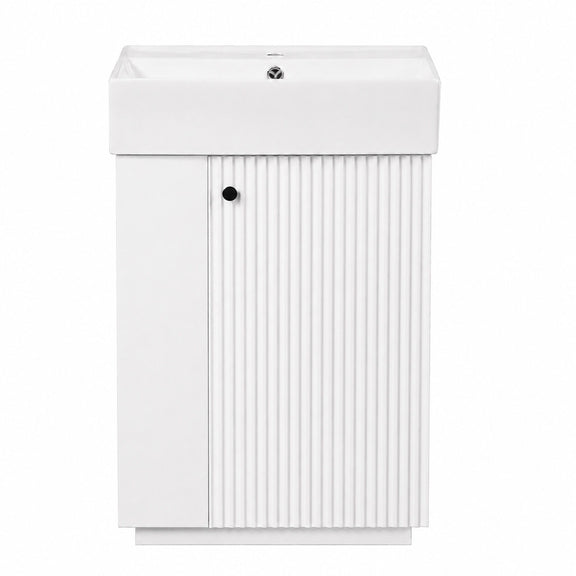 White freestanding bathroom vanity with sink top and vertical ribbed cabinet doors