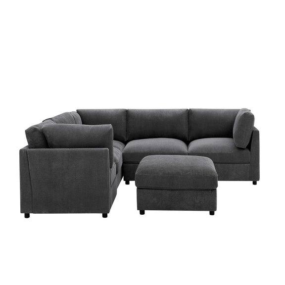 Dark gray modular sectional sofa with matching ottoman and rounded arm sections.