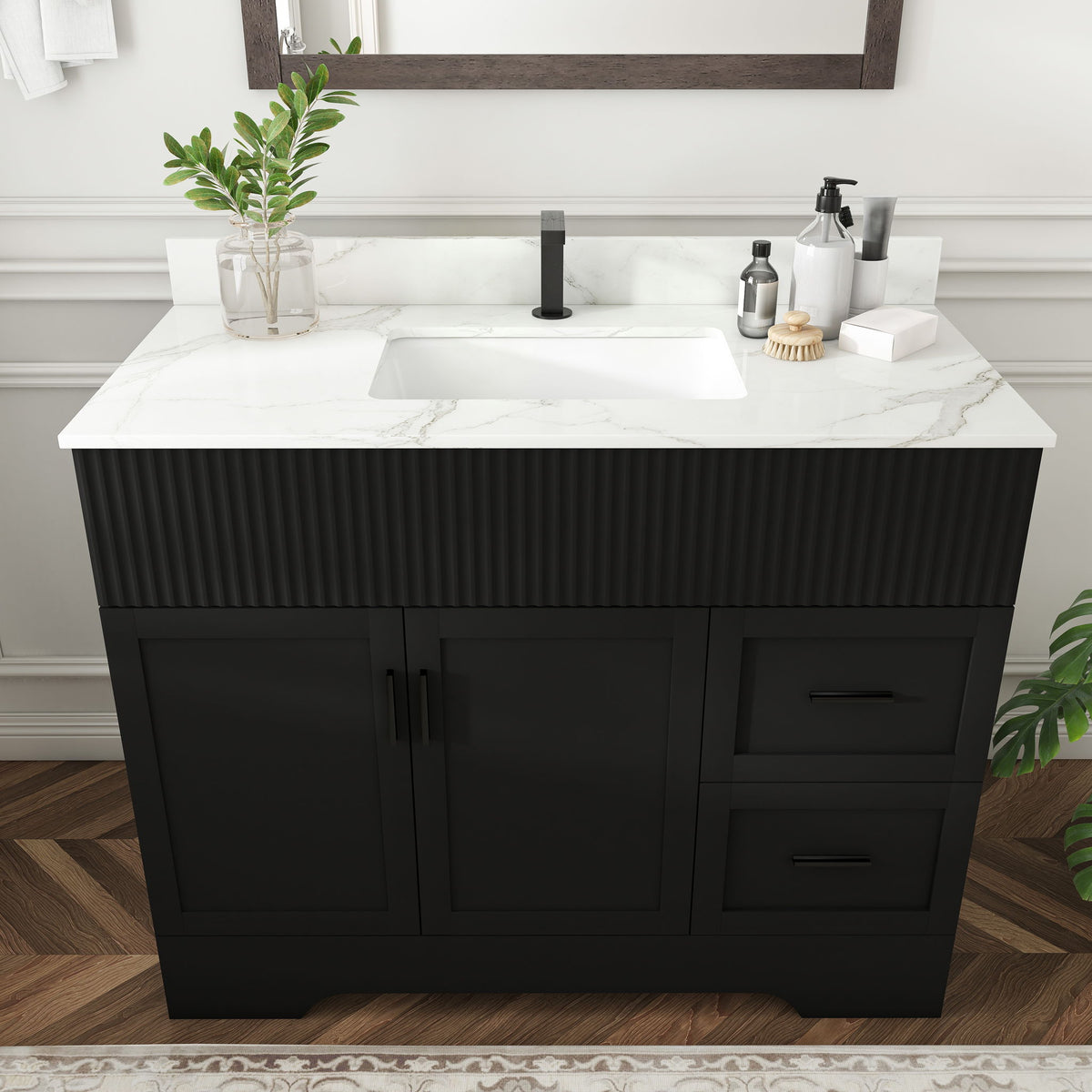 Black ribbed bathroom vanity with marble-look top, centered sink, cabinet doors and drawer