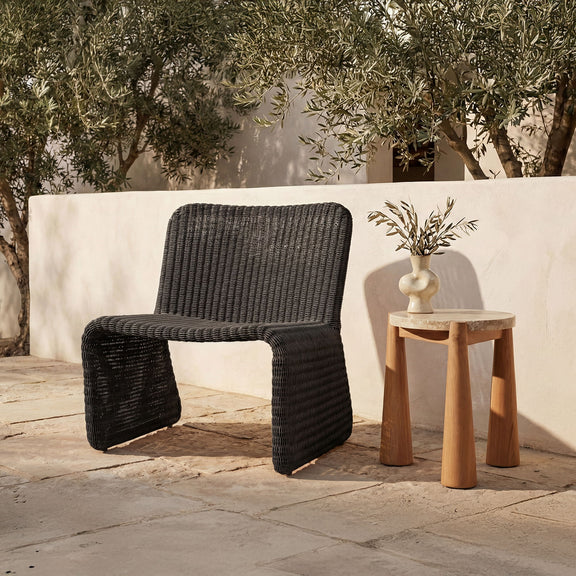 Charcoal woven outdoor accent chair with curved arms and thick padded seat