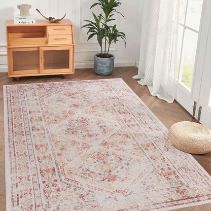 Beige washable area rug with red distressed ornamental medallion and border