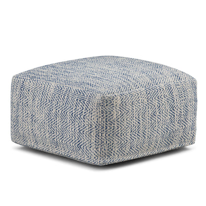 Blue handcrafted square pouf with rounded corners and textured woven cover
