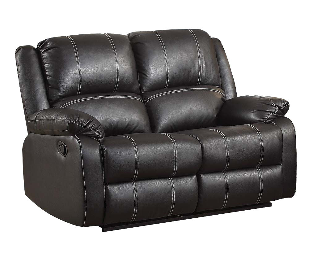 Black reclining armchair with button-tufted back, padded armrests, and seat cushions
