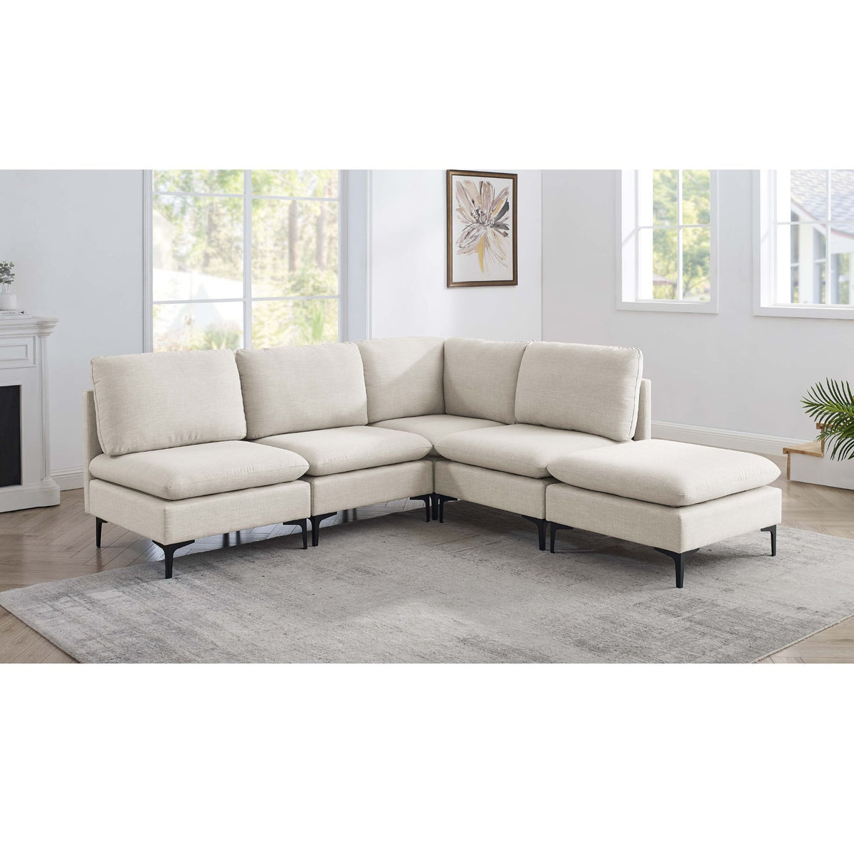 Beige modular sectional sofa with tall legs, medium-firm seat and ottoman chaise