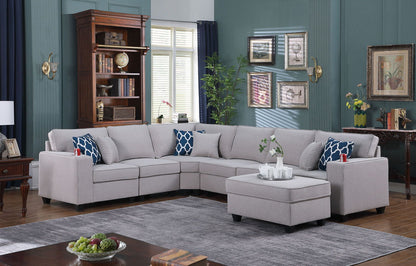 Gray sectional sofa with chaise ottoman and blue patterned accent pillows, corner layout