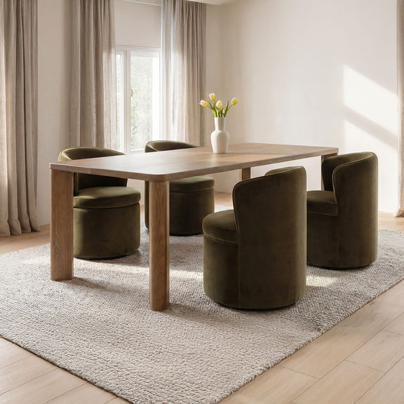 Large wooden dining table with vase centerpiece and green upholstered chairs
