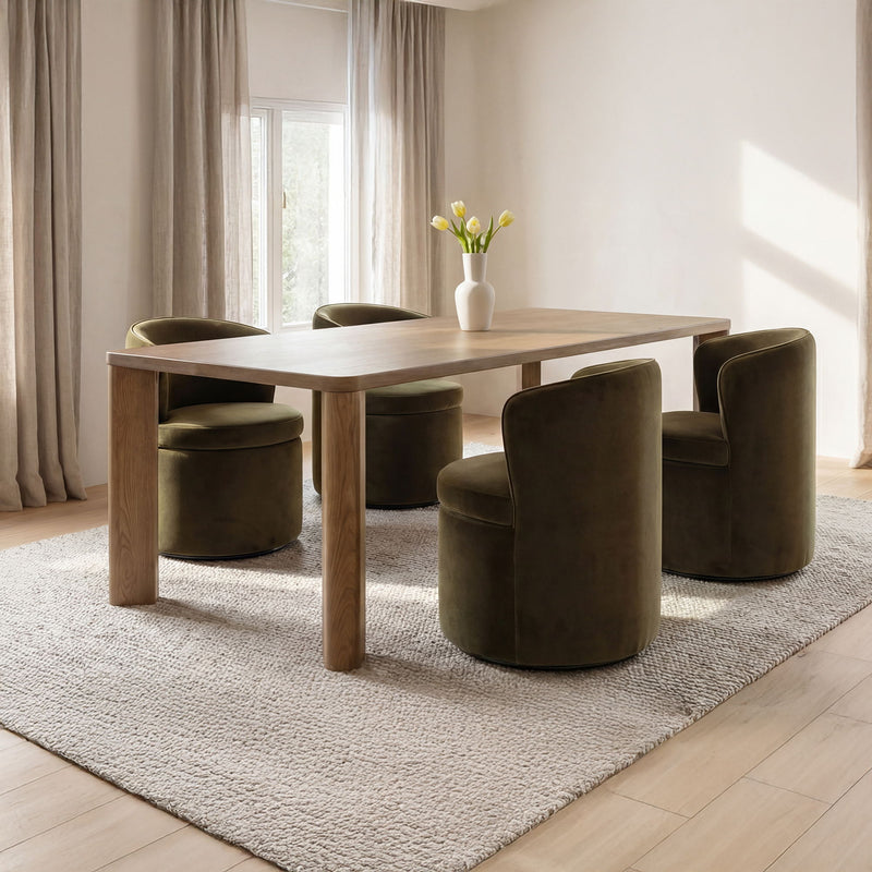 Large wooden dining table with vase centerpiece and green upholstered chairs