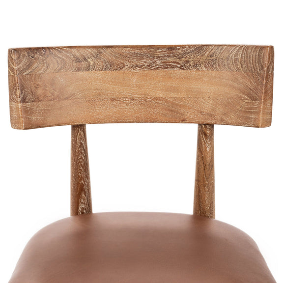 Leather dining chair backrest and seat, tan cushion, carved wooden frame