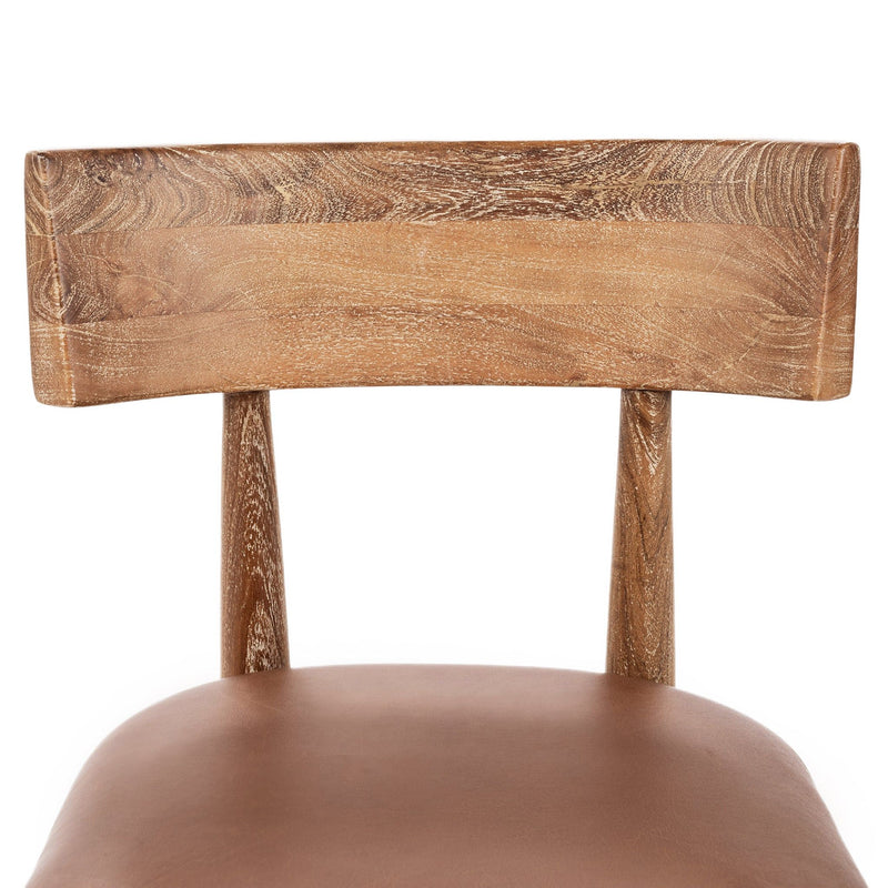Leather dining chair backrest and seat, tan cushion, carved wooden frame