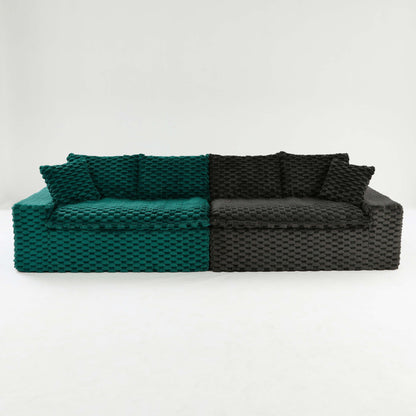 Modular sofa with dark gray and teal segments, textured fabric upholstery and back cushions
