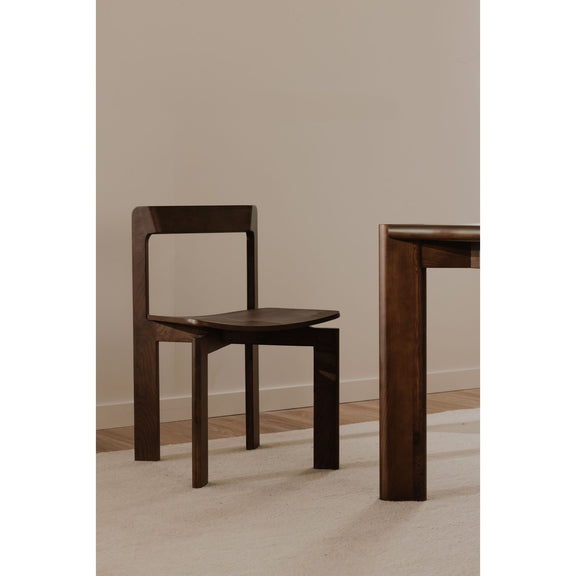 Walnut dining chair with open square back and dark wood seat, angled view