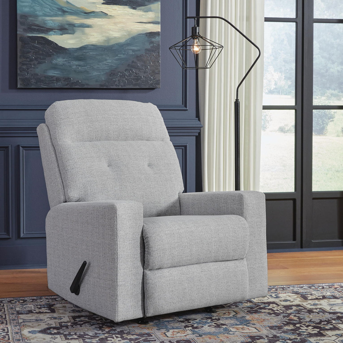 Stone gray fabric rocker recliner chair with padded arms and headrest