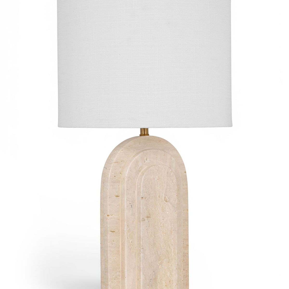 Table lamp with white fabric shade and beige textured stone base with gold stem