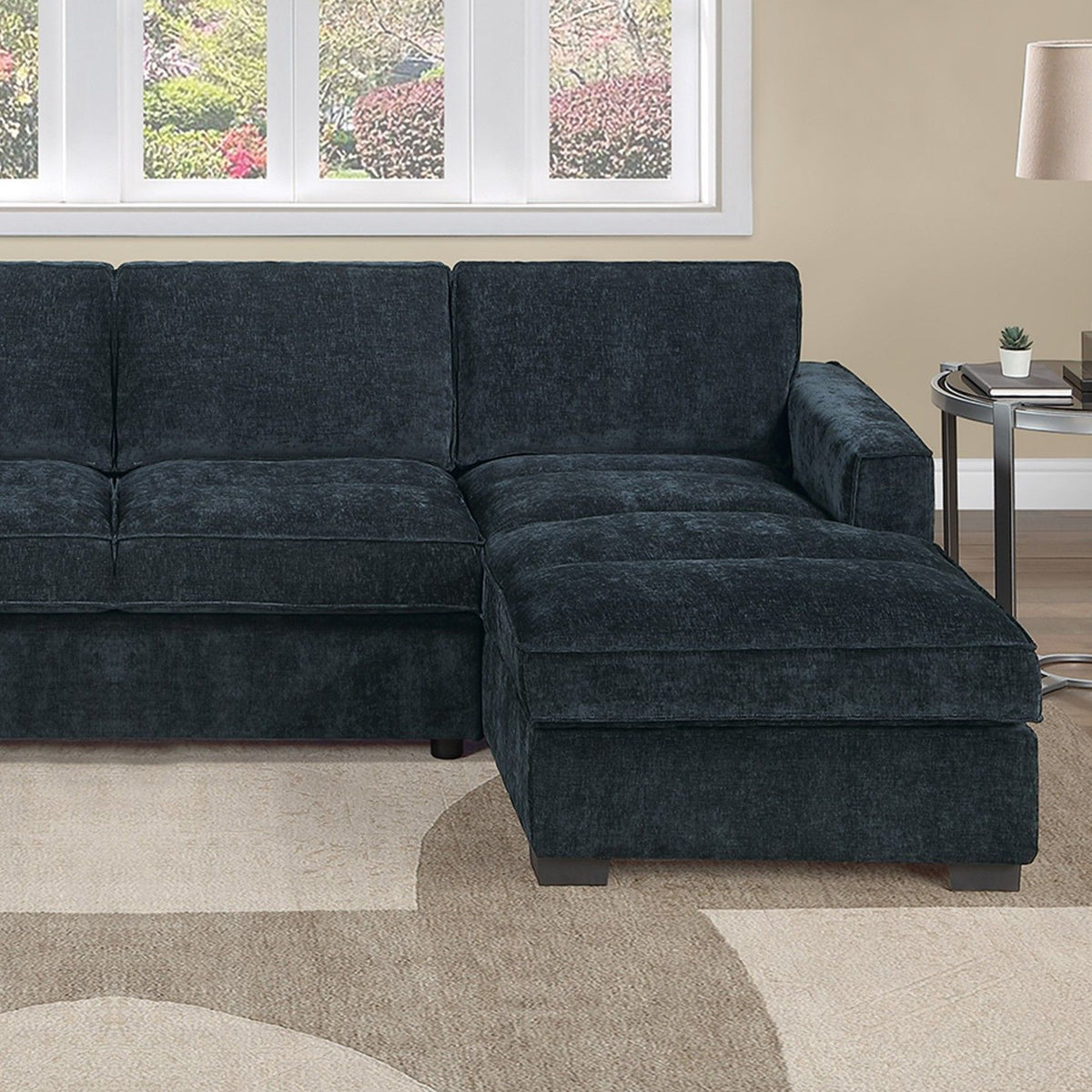 Dark upholstered sectional sofa with chaise, three wide seat cushions, square arms