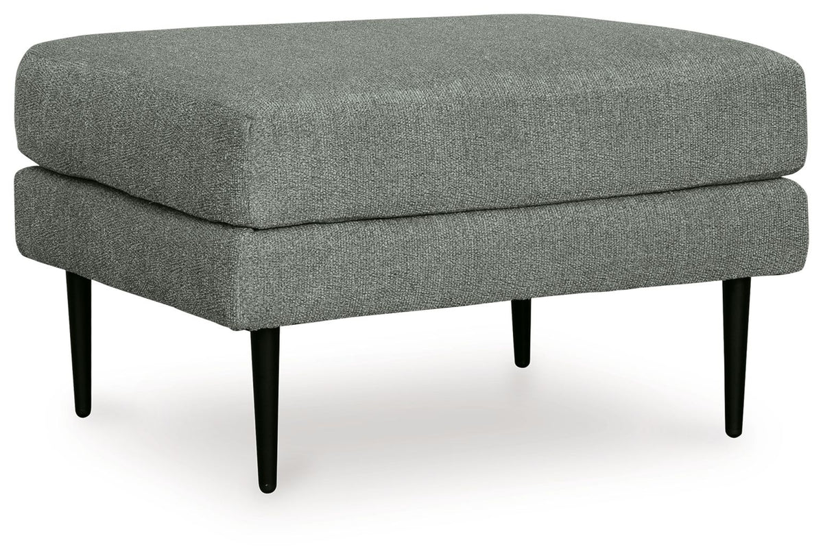 Charcoal fabric ottoman with rounded top and dark tapered wooden legs