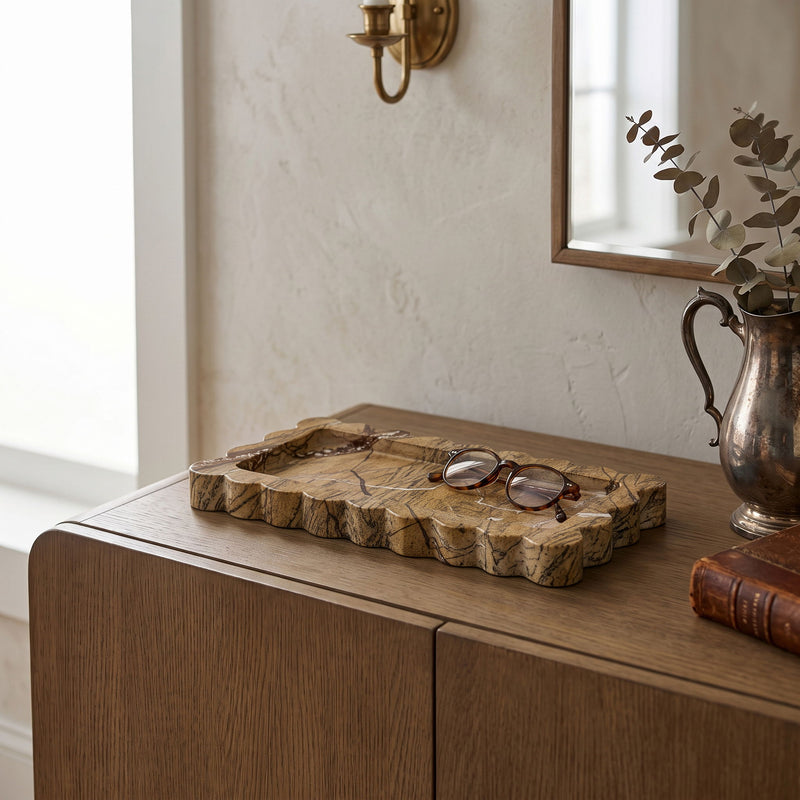 Brown marble tray with scalloped edges, shown with jewelry on a dresser